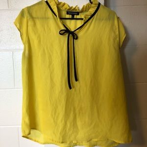 Sleeveless yellow blouse
